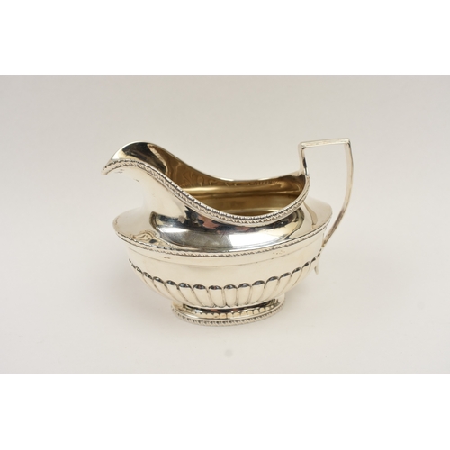 5011 - C.S. Harris & Sons Ltd silver sauce boat with melon-fluted detail, London 1927, 10cm tall x 14.5cm l... 