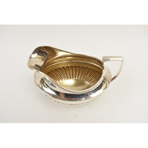 5011 - C.S. Harris & Sons Ltd silver sauce boat with melon-fluted detail, London 1927, 10cm tall x 14.5cm l... 