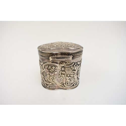 5018 - A Dutch imported silver heart form lidded container with embossed scenes.  Import marks for Samuel B... 