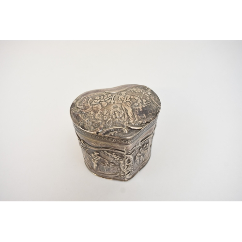 5018 - A Dutch imported silver heart form lidded container with embossed scenes.  Import marks for Samuel B... 