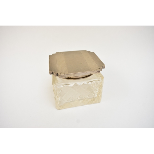 5044 - A crystal glass silver lidded container of Deco form.  The top marked 800, 7.5cm tall x 9cm x 9cm.  ... 