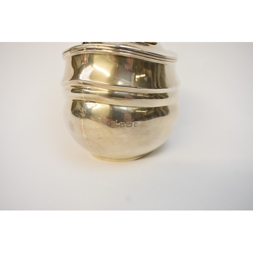 5051 - A Silver tea caddy with ebony knop finial of plain reeded form, makers mark rubbed, Birmingham 1926.... 