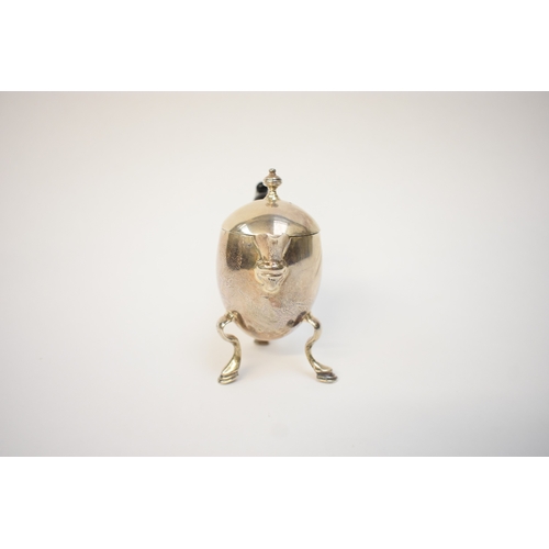 5054 - A Harry Freeman silver hot milk jug with detachable lid and treen handle (split and glued) raised on... 