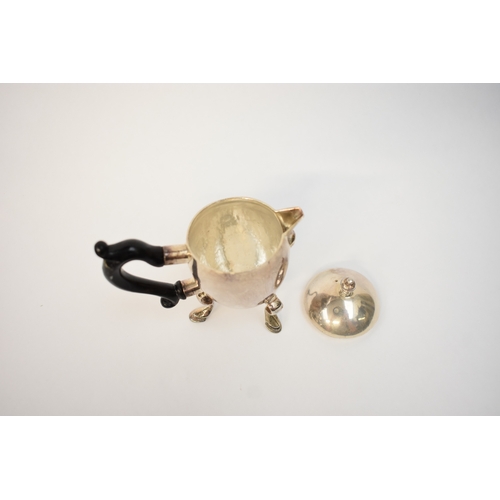 5054 - A Harry Freeman silver hot milk jug with detachable lid and treen handle (split and glued) raised on... 