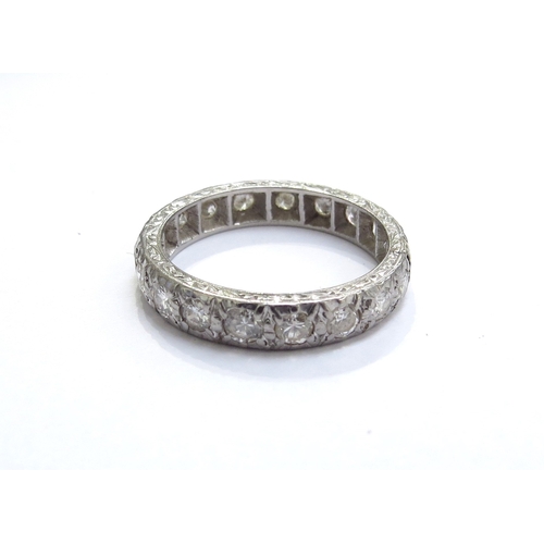7086 - A diamond full eternity ring. Size N, 4g