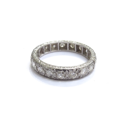 7086 - A diamond full eternity ring. Size N, 4g