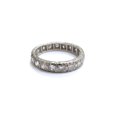 7086 - A diamond full eternity ring. Size N, 4g