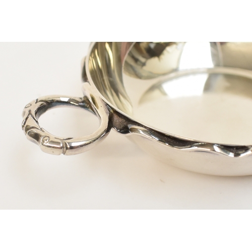 5062 - C J Vander Ltd, silver wine taster with serpent handle, London 1962, 8.2cm diameter, 89g