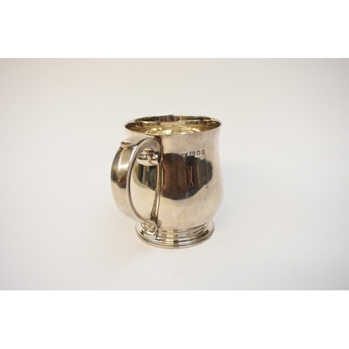 5041 - A Goldsmiths & Silversmiths Co Ltd silver pint tankard with S-Scroll handle, body initialled P J D, ... 
