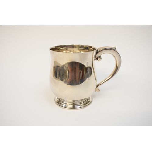5041 - A Goldsmiths & Silversmiths Co Ltd silver pint tankard with S-Scroll handle, body initialled P J D, ... 