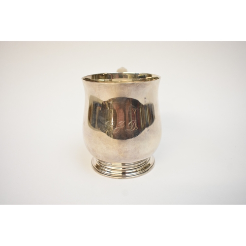 5041 - A Goldsmiths & Silversmiths Co Ltd silver pint tankard with S-Scroll handle, body initialled P J D, ... 