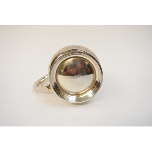 5041 - A Goldsmiths & Silversmiths Co Ltd silver pint tankard with S-Scroll handle, body initialled P J D, ... 