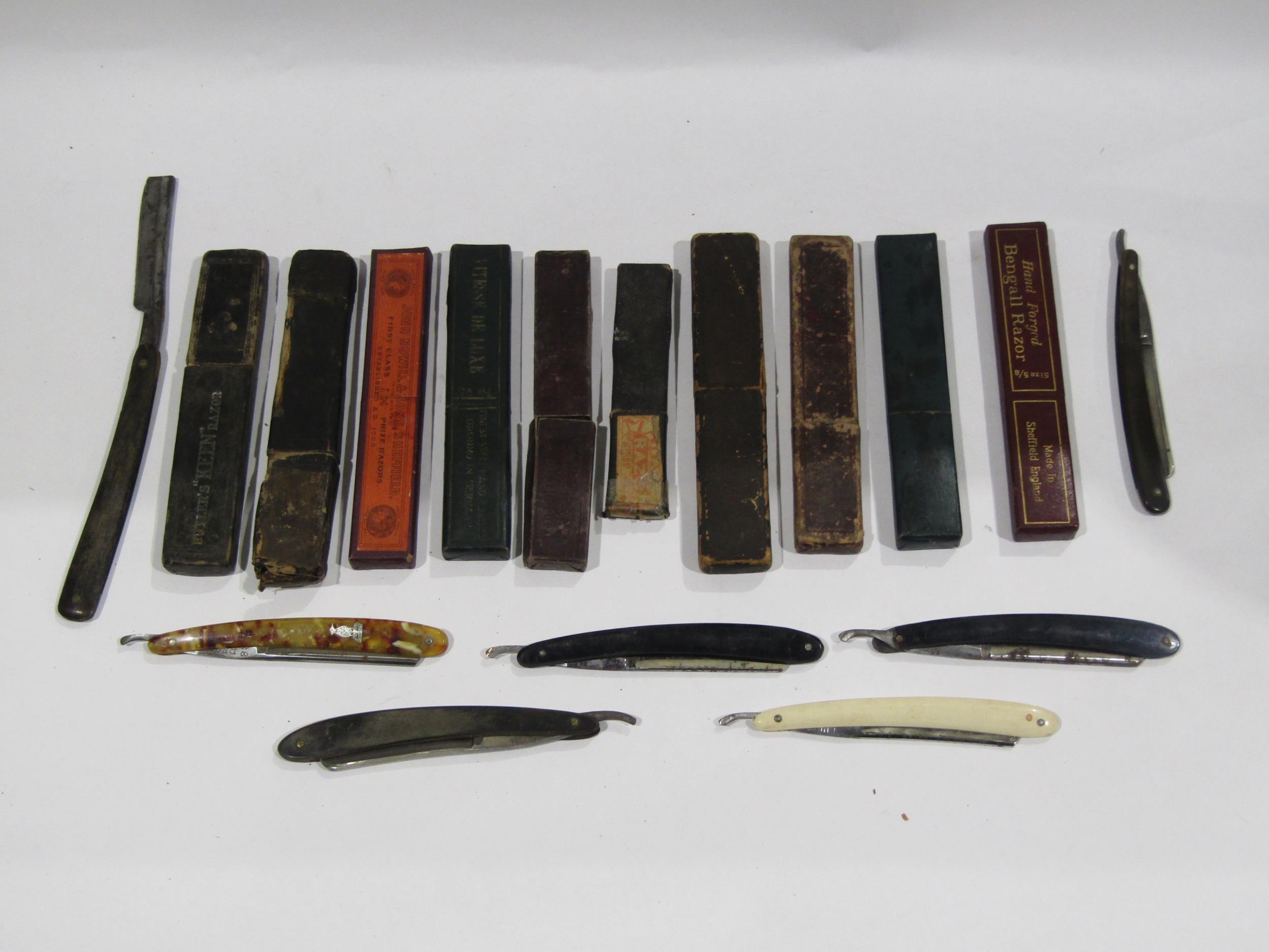 A small collection of cut throat razors including German examples