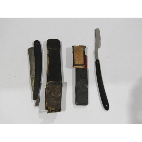 A small collection of cut throat razors including German examples