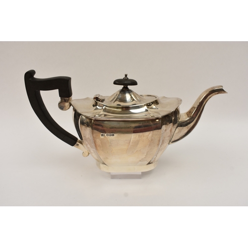 5008 - An L Harrison silver three piece tea set of classical form with ebony knop and handle, the sugar bow... 