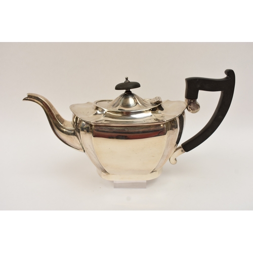5008 - An L Harrison silver three piece tea set of classical form with ebony knop and handle, the sugar bow... 