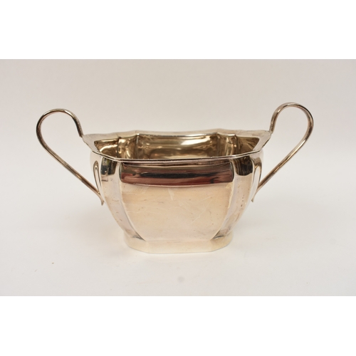 5008 - An L Harrison silver three piece tea set of classical form with ebony knop and handle, the sugar bow... 