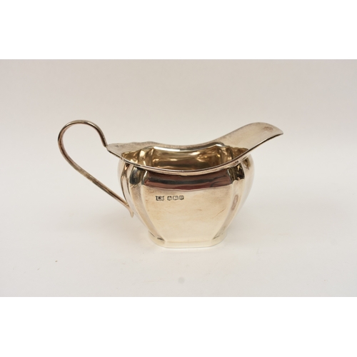 5008 - An L Harrison silver three piece tea set of classical form with ebony knop and handle, the sugar bow... 