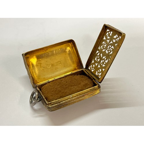 5112 - A William IV silver gilt vinaigrette fob, the foliate and floral edge with wavy and dappled engravin... 