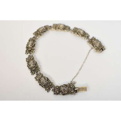 5119 - A white metal marcasite bracelet of floral form