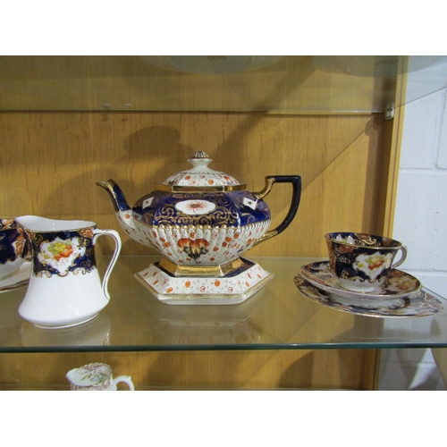 1005 - A Royal Albert Imari pattern part tea set, a teapot on stand and an Aynsley part tea set with floral... 
