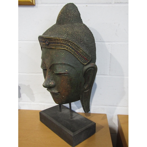 1015 - A large ornamental Buddha head with beadwork detail, 72cm height