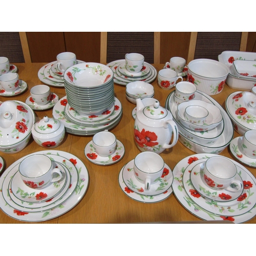 1018 - A Royal Worcester twelve place dinner and tea service in 'Poppies' pattern