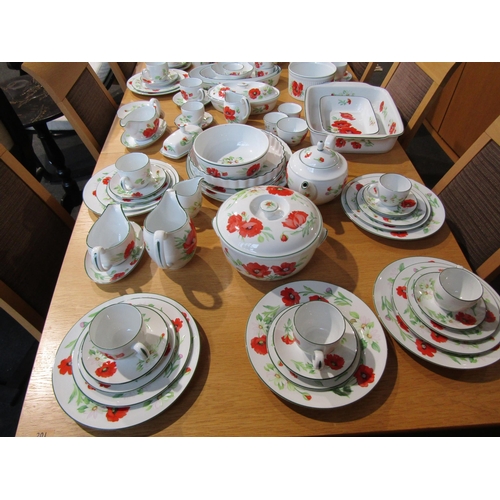 1018 - A Royal Worcester twelve place dinner and tea service in 'Poppies' pattern