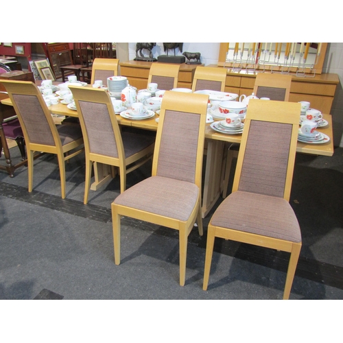 1019 - An oak extending dining table with two extra leaves, approximately 265cm long x 95cm wide extended, ... 