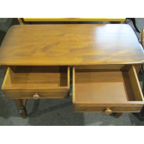1021 - An Ercol style elm two drawer side table, 75cm tall x 100cm wide x 48cm deep
