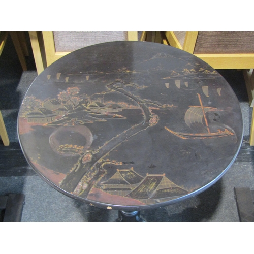 1026 - A chinoiserie ebonised circular top occasional table with pagoda and boat design, 53cm diameter