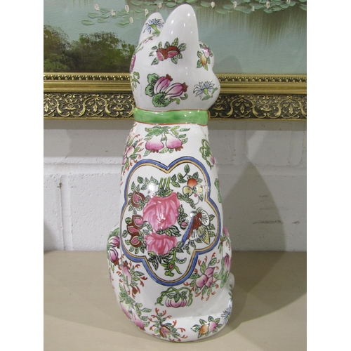 1030 - A pair of 20th Century Oriental ceramic seated cats with all-over floral design, character marks to ... 