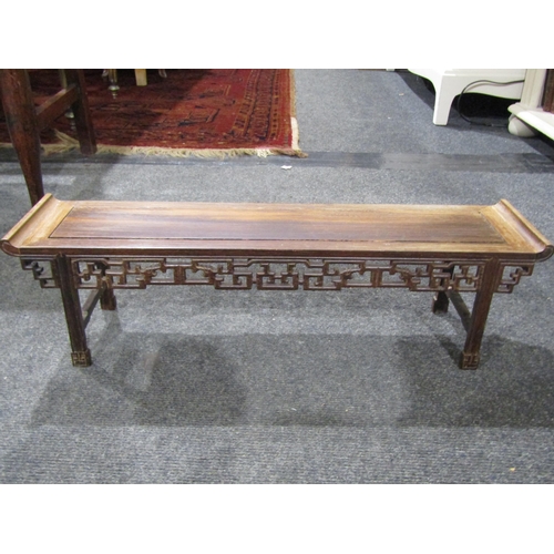 1032 - A reproduction Chinese physician's resin nude model with hardwood Oriental table, 52cm long