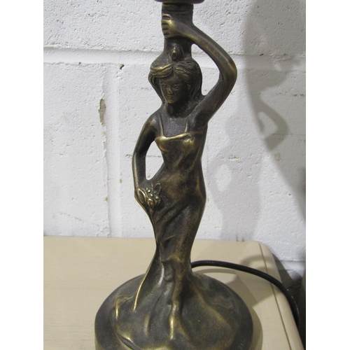1036 - A brass figural table lamp as a maiden, frosted glass shade aloft