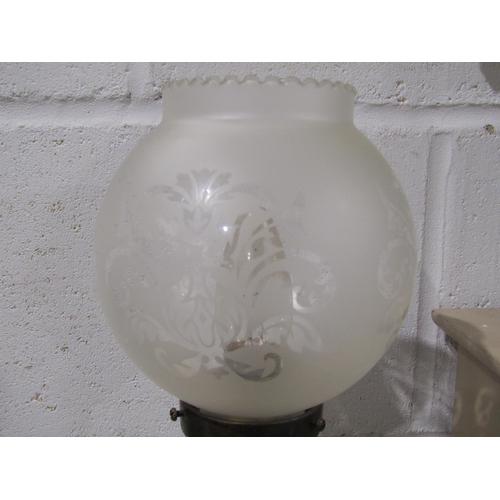 1036 - A brass figural table lamp as a maiden, frosted glass shade aloft