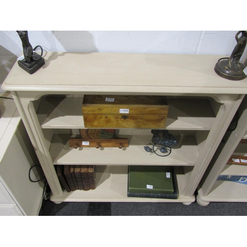 1039 - A painted three tier bookcase on bun feet, 96cm tall x 96cm wide x 26cm deep