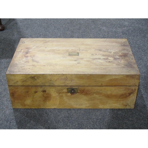 1040 - A writing slope with brass escutcheon and cartouche, red baize interior