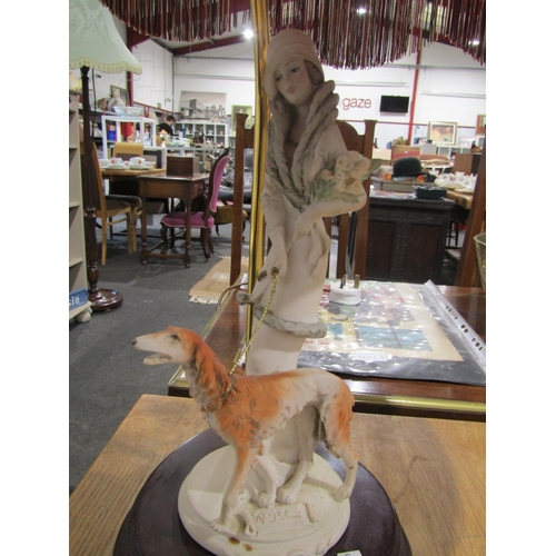 1045 - A Tiffany style lamp, a ceramic gilt lamp with wood base and an Italian lamp with red tasseled shade... 