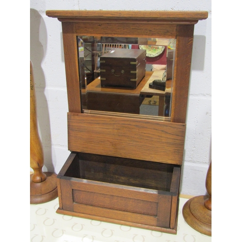 1048 - A pair of tall wooden candlesticks with gilt floral design and an oak mirror with box front (3)
