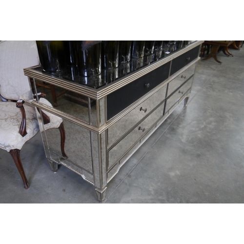 2004 - A mirror top chest of six drawers 181cm