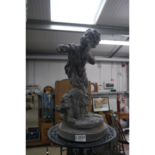 2024 - A 19th Century spelter figure of a boy