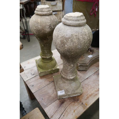 2037 - A pair of weathered composition balustrade finials