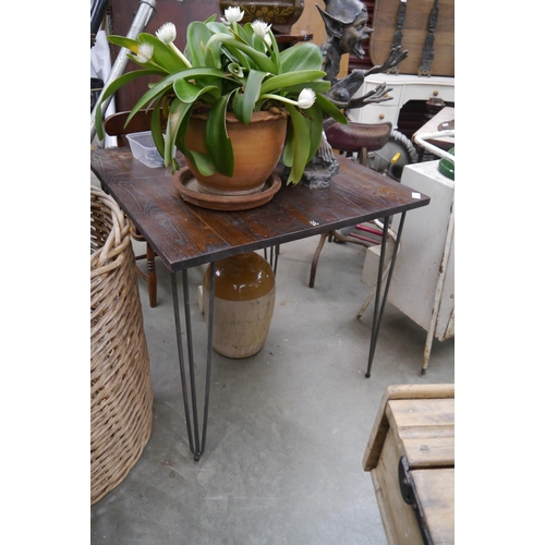 2058 - An oak cafe table on hair pin legs, height adjustable feet 80 x 80cm