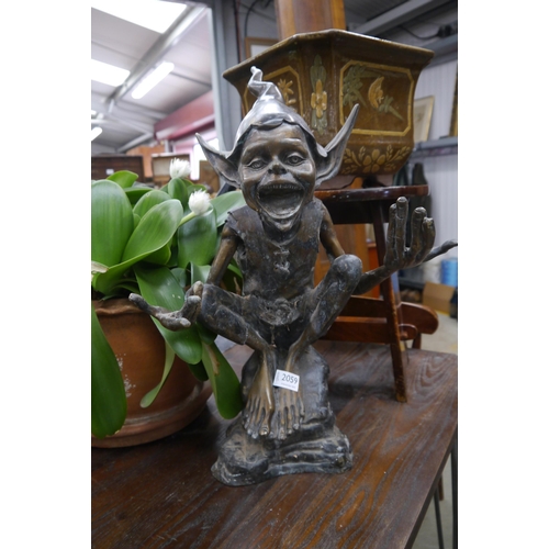 2059 - A bronze study of a seated garden pixie, 58cm tall