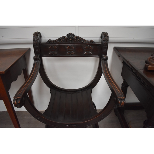 4012 - An 18th Century style Renaissance Savonarola armchair with carved decoration the 
