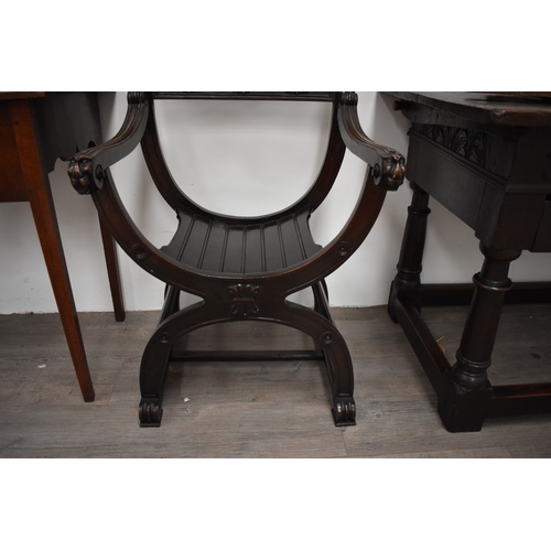4012 - An 18th Century style Renaissance Savonarola armchair with carved decoration the 