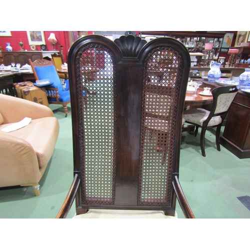 4021 - A Charles II revival walnut open armchair, the carved double dome top back rest with carved detail o... 