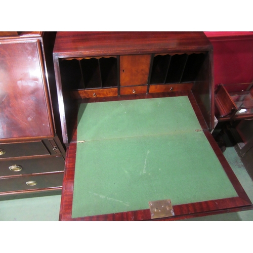 4082 - A George III style crossbanded flame mahogany bureau, the fitted interior over four drawers on outsw... 