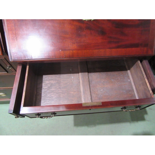 4082 - A George III style crossbanded flame mahogany bureau, the fitted interior over four drawers on outsw... 