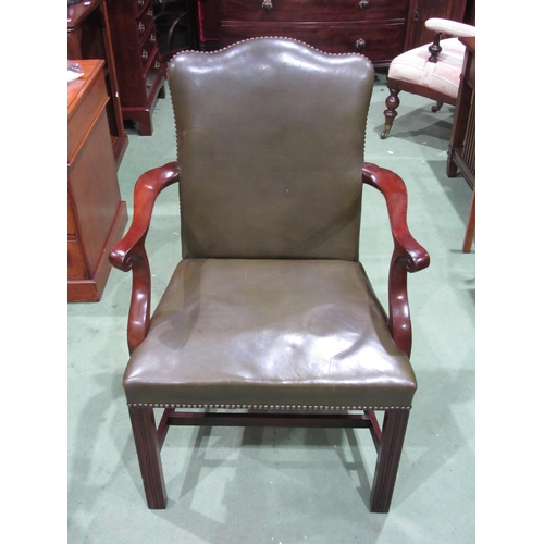 4002 - A Gainsboro 19th Century style mahogany and leather upholstered open armchair with metal stud decora... 